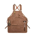 Flat lay of brown canvas work apron with leather straps and multiple tool pockets - Webbing Edge Camel