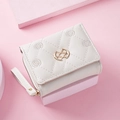 White quilted tri-fold wallet for women with elegant embroidery and gold metal clasp - White
