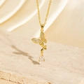 Elegant gold butterfly necklace featuring crystal wings and clear teardrop pendant - BXL0256-9 Butterfly Teardrop Necklace
