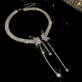 Macro view of crystal butterfly choker featuring elegant sparkling tassel pendants - Butterfly Style Tassel / Silver