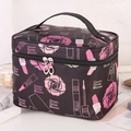 Floral makeup bag with pink roses and Dream Grow Bloom text on black background - Black Rose