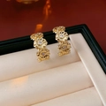 Golden flower cluster drop earrings with sparkling crystals in a black jewelry box - Triple Flower / Gold