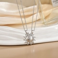 Macro detail of sun puzzle necklaces with You Are My Sunshine engraving and zircon inlay - Silver Sunshine Interlocking Sun XL0482G