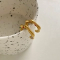 Irregular gold wave earrings with colorful rhinestones on white ceramic cup edge - Gold Wave Colorful Zirconia Style (DEK1653)