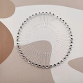Detail of a stretchable circular hair comb featuring sparkling silver rhinestones on clear teeth - Transparent with Round Rhinestones