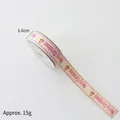 Cream 1.6cm Christmas ribbon with pink deer and Merry Christmas print for gift wrapping - 1.6cm White Background With Red Lettering