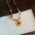 Macro detail of retro tiger eye beaded necklace with a golden five-petal flower pendant - Gold Five-Petal Red Brown (34#)