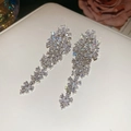 Detail of floral tassel earrings with sparkling zircons on white leather jewelry box - 76# Silver Needle - Silver - Flower.