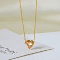 Elegante 18k vergulde hartketting met champagne zirkonia hanger aan een fijne ketting - Goud met champagne zirkoon