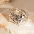 Detailed view of silver leaf-inspired cuff bracelet with intricate vein textures on stone - Silver Glossy Hinge Bangle