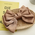 Close-up of a large three-layer brown satin bow hair clip with a rich glossy texture - Light Coffee Triple Layer