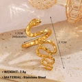 Golden snake-shaped stainless steel ring in vintage style on a textured stone pedestal - Gold Ring 751