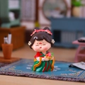 Tang dynasty lady figurine in red and green hanfu holding flower basket ornament - Chang'an Lychee (Small) / 【product Attributes】this Is A Small Resin Figurine Of A Tang Dynasty-style Q-version Lady. The Character Wears A Traditional Hanfu In Red And Green Holds A Flower Basket Smiles With Her Eyes Closed Has Red Floral Decorations On Her Face And Her Hair Is Adorned With Delicate Flowers Exuding A Strong Sense Of Chinese-style Art. 【visual Presentation】the Image Uses A Miniature Real-scene Shooting Style With The Product In The Center Of The Picture. The Background Consists Of Miniature Chinese-style Furniture And Scrolls. The Overall Color Scheme Is Warm And Harmonious And The Large Aperture Blurring Effect Makes The Subject Stand Out. Image Quality Is High With Sharp Details And Natural Lighting. Aesthetics Are High With An Overall Score Of 8.8. The Props And Product Have A Unified Sense Of Quality And The Visual Appeal Is Excellent. 【text Content】there Is No Visible Text Or Watermark In The Image So No Processing Is Required. 【logistics Labels】none. 【infringement Risk】the Main Body Of The Product Belongs To The Original Chinese-style Design And No Infringement Features Of Specific Brands Or Well-known Ips Were Found. Background Infringement: None. 【product Parameters】tang Dynasty-style Q-version Figurine Colorful Resin Texture Scene Display.