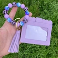 Detailed view of purple silicone bead bracelet keychain with leopard print and PU card holder - Taro Purple