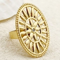 Macro shot of gold plated oval ring featuring hollow sunflower design and small zircon - Hollow Sunflower with Zircon / Gold