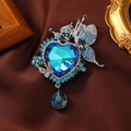 Luxury blue crystal heart brooch with colorful butterfly and drop tassel on silk background - Blue