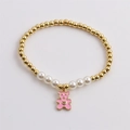 Bracciale di perle e sfere dorate con un grazioso ciondolo a forma di orso rosa - Ciondolo Orso Smaltato / Rosa