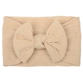 Soft beige nylon baby headband featuring a large jacquard bow for infant girls - Beige