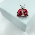 Detail of ladybug brooch featuring red enamel, black crystals and a large pearl base - Pearl Base Red Enamel Ladybug
