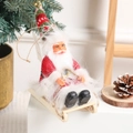 Christmas Santa Claus sitting on a wooden sleigh with a red striped knitted hat - Red and Green Plaid