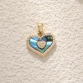 Close-up of heart-shaped gold necklace pendant with abalone shell and tiny diamonds - A0355 Heart Abalone Shell