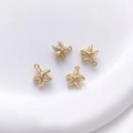 Detailed view of four 14K gold plated starfish pendants with top loops for DIY jewelry - 4# Starfish 9x10mm