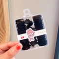 Kids hair accessories set featuring black elastic bands and matte floral hair clips - Black