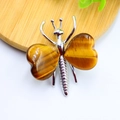 Tiger eye butterfly ornament with heart-shaped natural crystal wings in silver setting - White K Plated Tiger Eye