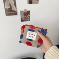Light coffee plush bucket bag with colorful pompoms and sozakka label detail - Lipstick Pouch