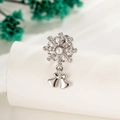 Silver snowflake bow earrings with white pearl and sparkling crystals on display stand - Snowflake Bow (A1020-Single Piece)