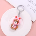Schattige Shiba Inu sleutelhanger in roze konijnenpakje met klein schoudertasje - Roze konijnenkostuum / Roze