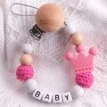 Detail of pink beech wood pacifier clip with crochet beads, silicone crown and BABY letter beads - Rose Red
