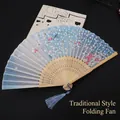 Japanese style folding fan in navy blue with pink cherry blossom pattern and silk tassel - Blue Cherry Blossom Rain