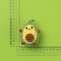Handmade crochet avocado keychain with green and yellow yarn and hanging loop - Avocado Doll Pendant