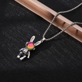 Macro shot of silver robot pendant with rabbit ears and a sparkling colorful gemstone - XL13 / Bunny Ear Robot / Silver