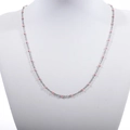 Detailed macro view of pink enamel beads on a polished silver stainless steel chain necklace - Steel + Pink