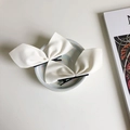 Pair of elegant white bow hair clips with black metal pins on a pearl tray - One Pair / White Pair (Left & Right)
