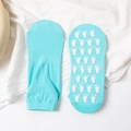 Green anti-slip trampoline socks with white rubber foot-shaped grips on the bottom - Adult Size (EU 35-42) / Sky Blue