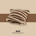 Detail of the chunky knit texture and cat ear design on the striped wool beanie - Khaki and Brown Stripe