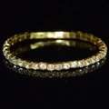 Macro detail of gold stretch bridal bracelet with multiple rows of sparkling crystals - 1 Row Gold Clear Rhinestone Bracelet