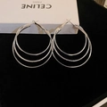 Macro shot of silver triple-layered geometric hoop earrings with polished metallic finish - Multi-layer Intertwined (25#)