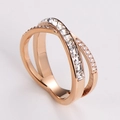 Detail of rose gold X-shaped crisscross ring with square and round cubic zirconia inlays - US 5 / Rose Gold