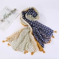 Close-up of lightweight linen beach shawl with tassels and blue polka dot pattern - Style 14
