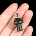 Dark green crystal mushroom pendant with silver metal bail held in hand for jewelry DIY - Gun Black Cap / India Agate