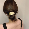 Minimalist brushed gold rectangular metal hair tie cuff on a model's ponytail bun - Rectangle / Gold