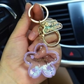 Purple sakura floating glitter acrylic keychain with gold clasp and Sakura Festival text - Purple