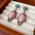 Detailed close-up of vintage pink hollow drop earrings with dark metal finish - Silver Pin - Gunmetal Black (Pink Stone)