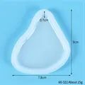 Detailed view of translucent heart-shaped puzzle silicone mold with dimension annotations - 60-322 Irregular Teardrop