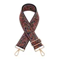 Close-up of adjustable paisley jacquard bag strap with gold metal swiveling hooks - Black Orange