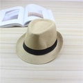 Classic light khaki fedora sun hat with a decorative black ribbon band on wooden surface - One Size / Beige